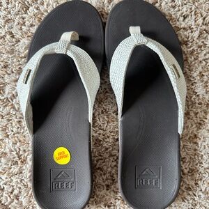 Reef flip flops arch support.  White/silver